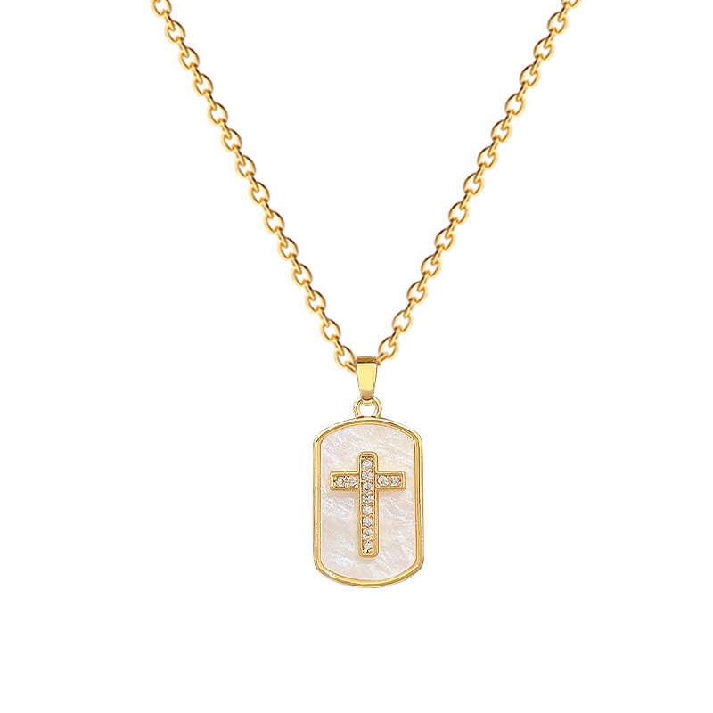 Collar con cruz en forma de concha